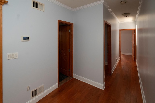 hall featuring dark hardwood / wood-style flooring and ornamental molding