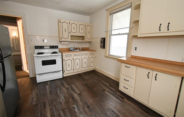 kitchen with decorative backsplash, stainless steel fridge, sink, white electric stove, and dark hardwood / wood-style floors