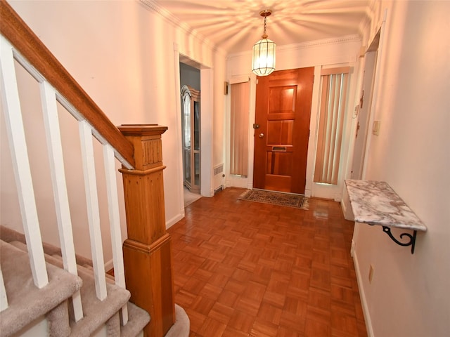 interior space with crown molding and parquet floors