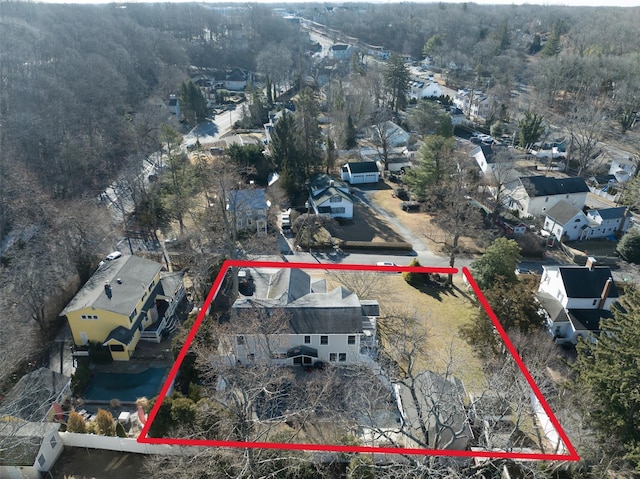 drone / aerial view featuring a forest view