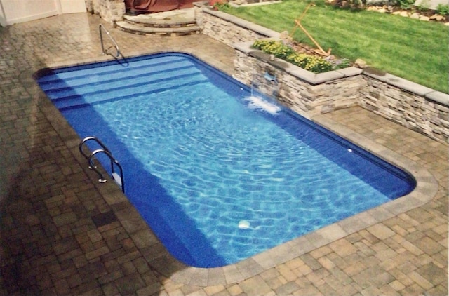 pool featuring a patio area