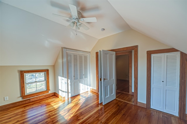 bonus room featuring lofted ceiling, baseboards, ceiling fan, and hardwood / wood-style floors