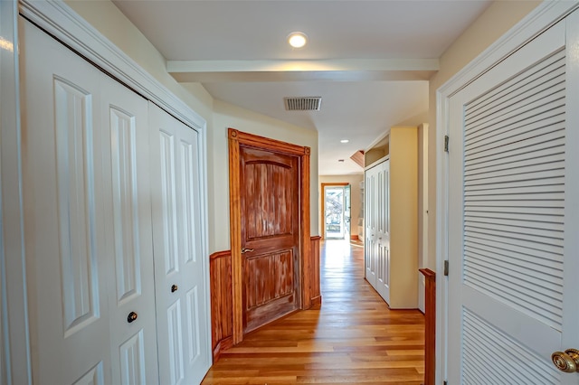 hallway with recessed lighting, visible vents, and light wood-style flooring