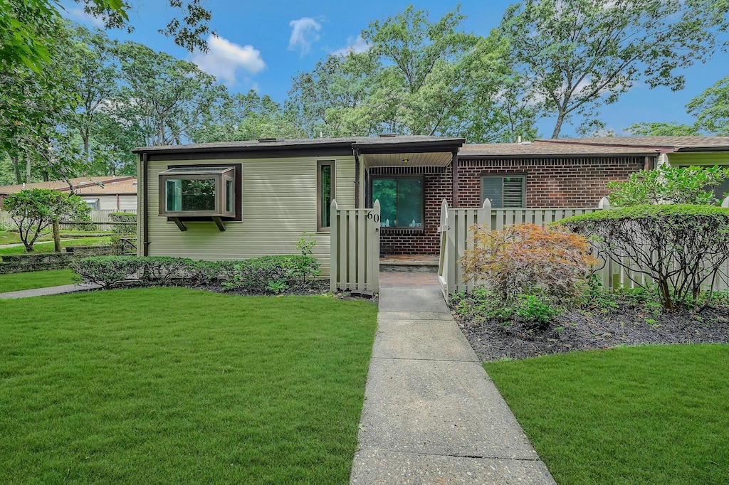 view of front of home with a front yard