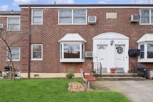 view of front of house featuring an AC wall unit