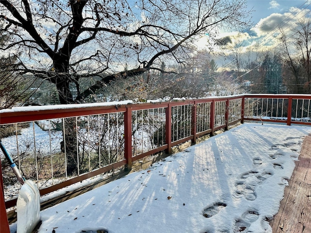 view of snow covered deck