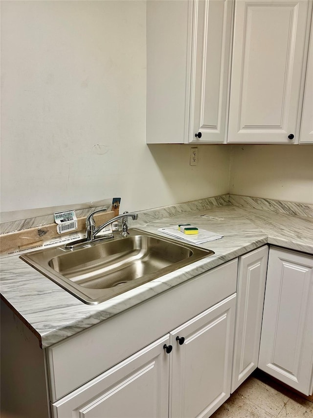 kitchen with sink and white cabinets