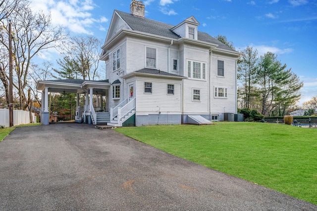 view of home's exterior featuring a yard and central AC unit