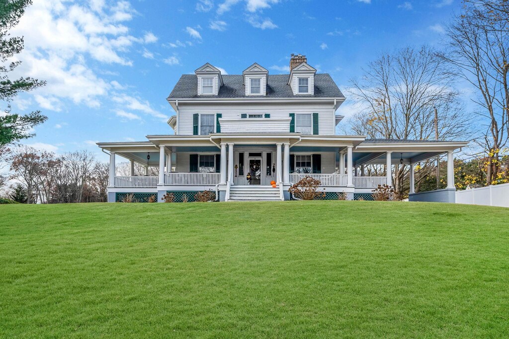397 Split Rock Rd, Syosset, NY 11791 - view of front of home featuring a porch and a front lawn