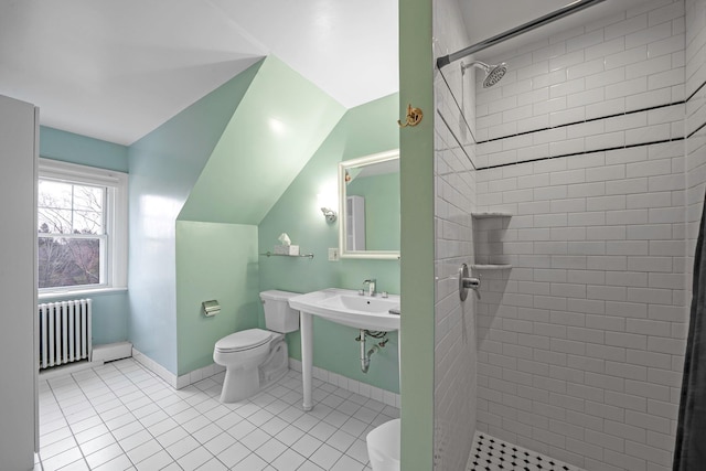 bathroom with radiator, tile patterned flooring, lofted ceiling, tiled shower, and toilet