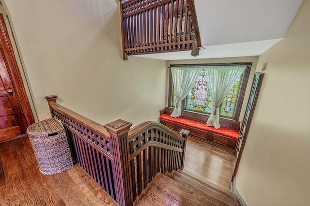 staircase featuring hardwood / wood-style floors