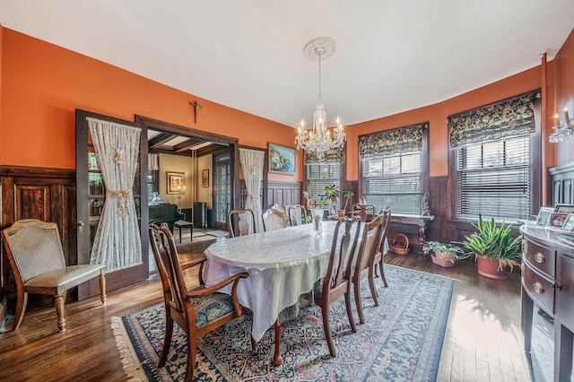 dining room with a notable chandelier and wood-type flooring