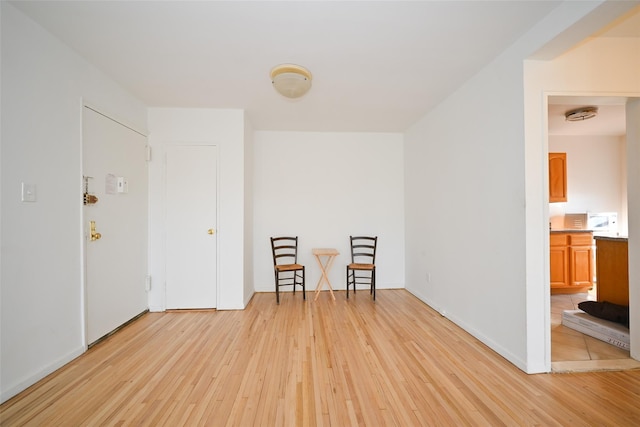 unfurnished room with light hardwood / wood-style floors