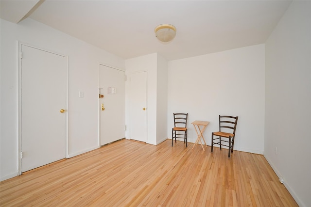 sitting room featuring hardwood / wood-style flooring