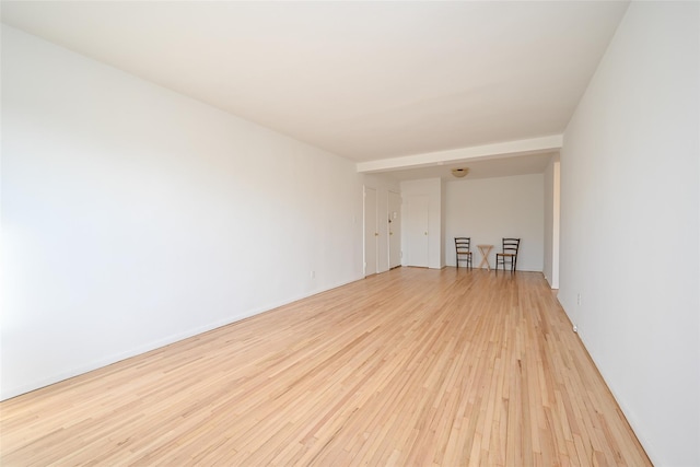 spare room with light hardwood / wood-style floors