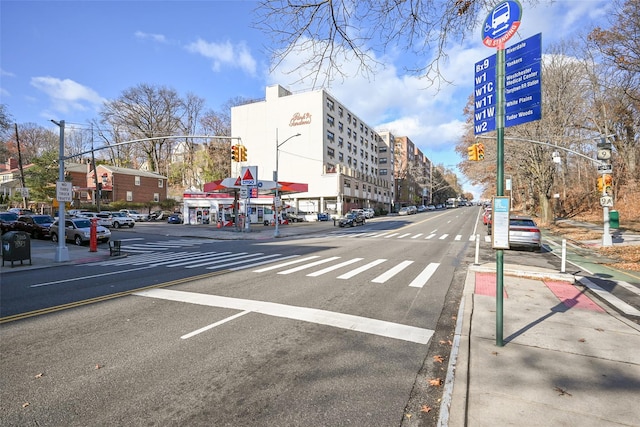 6535 Broadway Unit 6A, Bronx, NY 10471 - view of asphalt street featuring sidewalks, curbs, street lights, traffic signs, and traffic lights