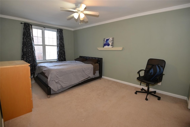 carpeted bedroom featuring ceiling fan and crown molding