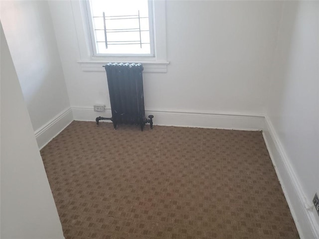 spare room featuring radiator