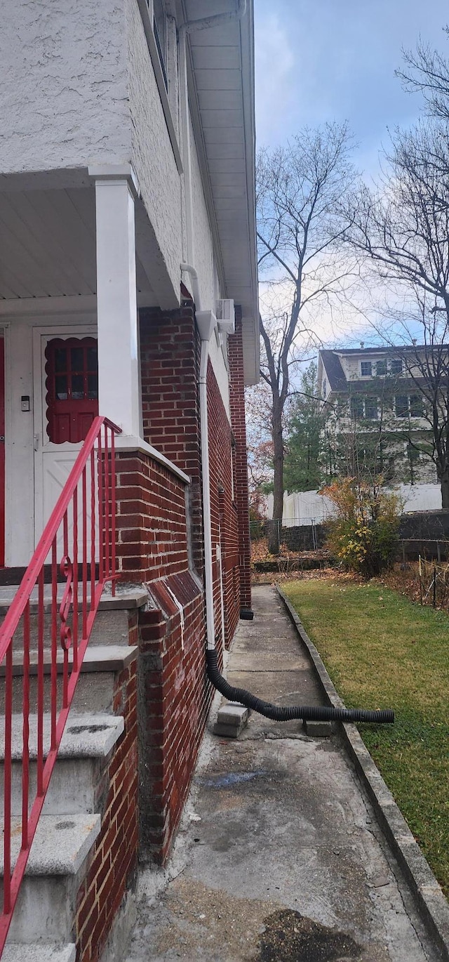 view of side of home featuring a yard