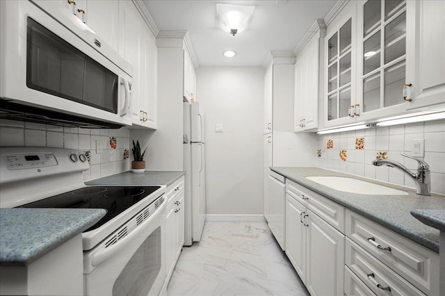 kitchen featuring sink, white appliances, decorative backsplash, and white cabinets