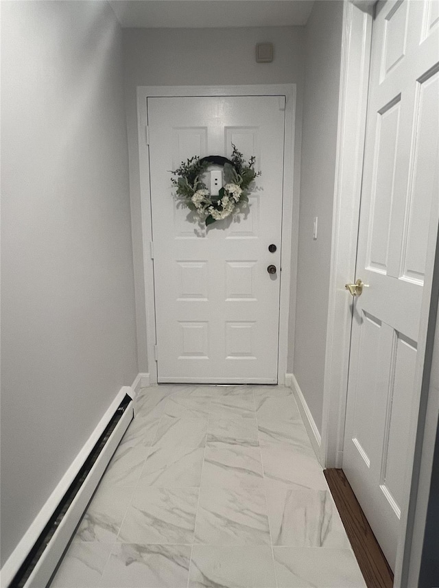 entryway with a baseboard heating unit