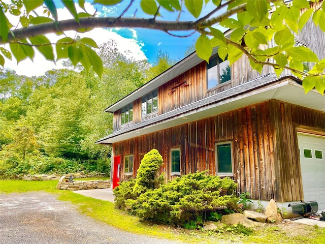 view of side of property with a garage