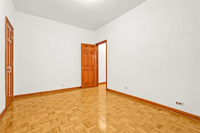 unfurnished room featuring light parquet flooring