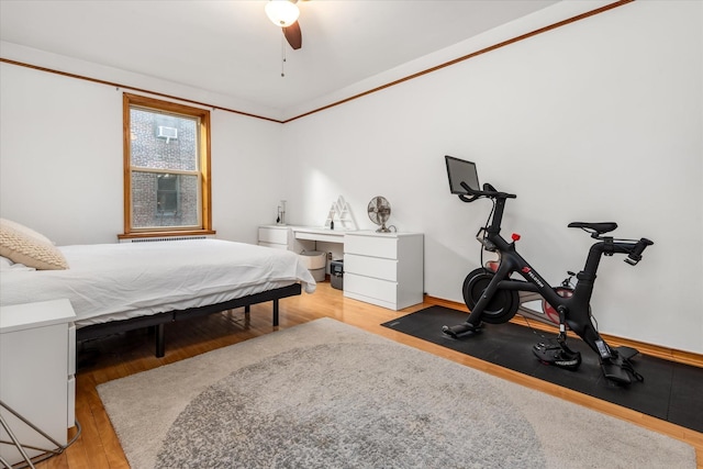 bedroom featuring light hardwood / wood-style flooring and ceiling fan