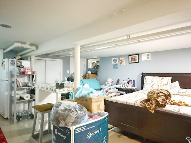 bedroom with white fridge