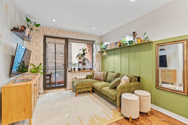 living room featuring a wealth of natural light and light wood-type flooring