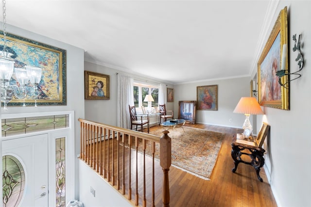 living room featuring wood-type flooring and ornamental molding