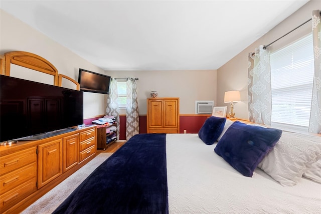 bedroom featuring a wall mounted air conditioner