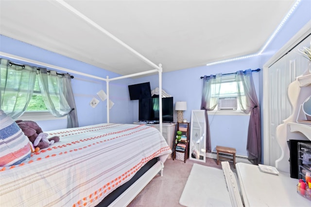 carpeted bedroom with a baseboard radiator and a closet