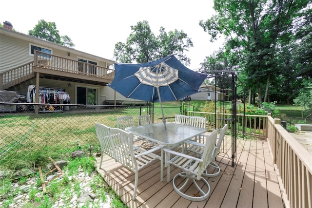 wooden deck with a yard