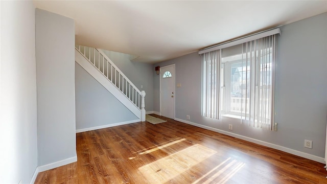 entryway with hardwood / wood-style floors