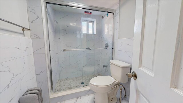 bathroom featuring an enclosed shower and toilet