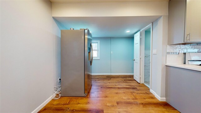 hall with light wood-type flooring