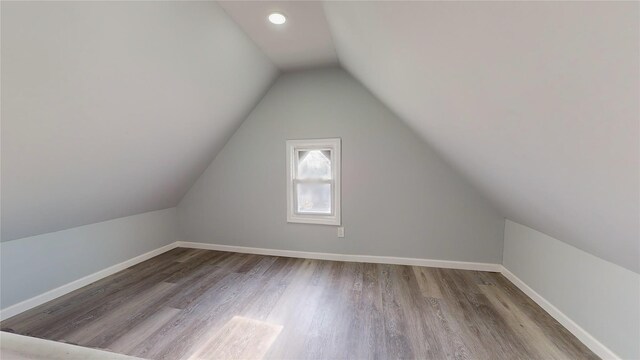 bonus room featuring light hardwood / wood-style floors and lofted ceiling