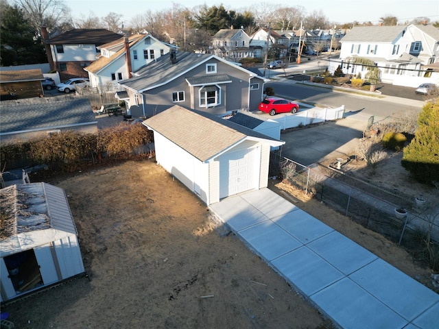 birds eye view of property with a residential view