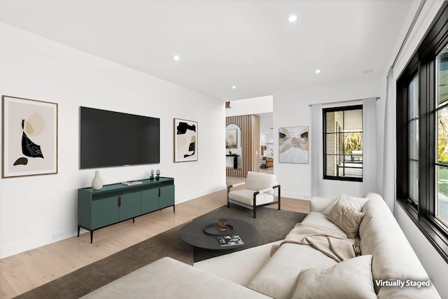 living room with light hardwood / wood-style flooring