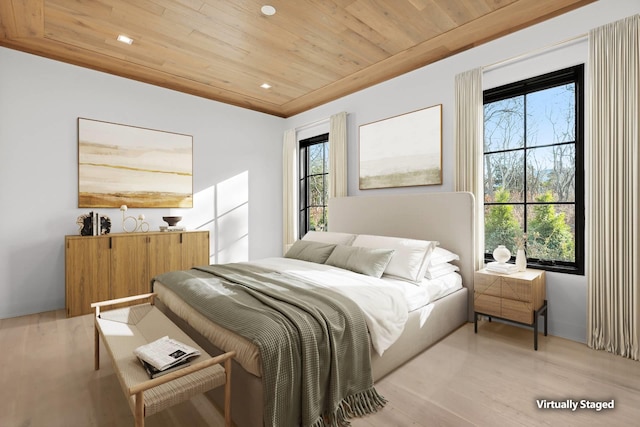 bedroom featuring wood ceiling and light hardwood / wood-style floors