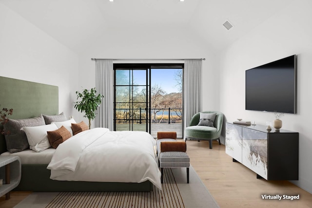 bedroom with access to exterior, high vaulted ceiling, and light wood-type flooring