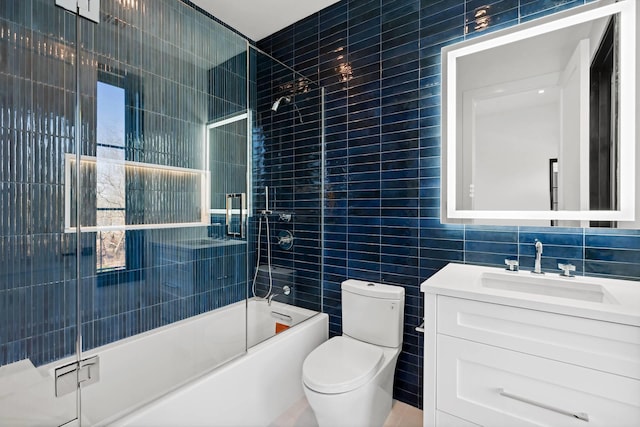 5 Widow Coopers Path, Sag Harbor, NY 11963 - full bath featuring tile walls, toilet, vanity, and enclosed tub / shower combo