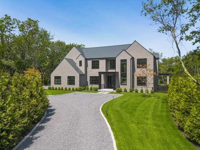 5 Widow Coopers Path, Sag Harbor, NY 11963 - view of front of home with driveway, a front lawn, and metal roof