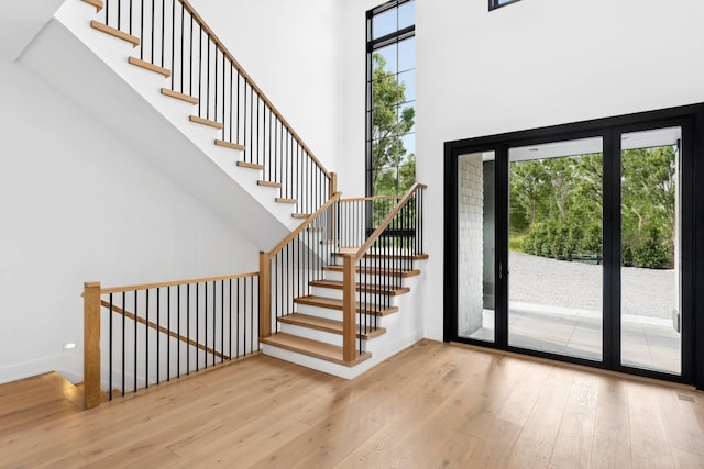 5 Widow Coopers Path, Sag Harbor, NY 11963 - entryway with a towering ceiling, wood finished floors, stairway, and baseboards