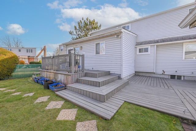 deck featuring a lawn