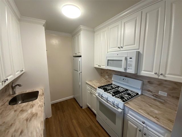 kitchen featuring sink, dark hardwood / wood-style floors, white appliances, white cabinets, and ornamental molding