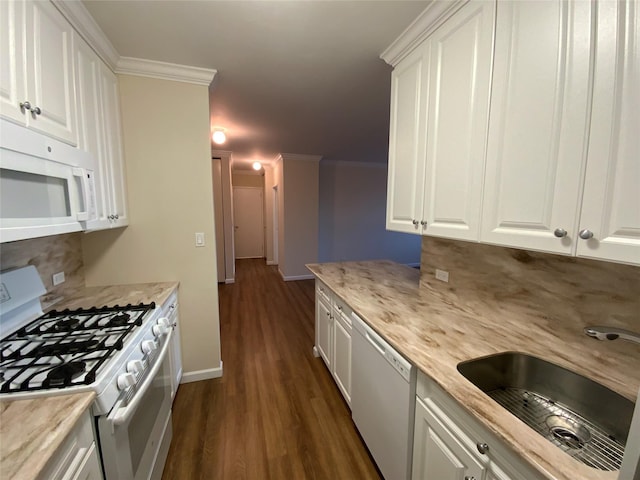 kitchen with sink, tasteful backsplash, dark hardwood / wood-style floors, white appliances, and white cabinets