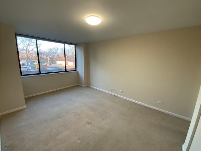 empty room featuring light carpet