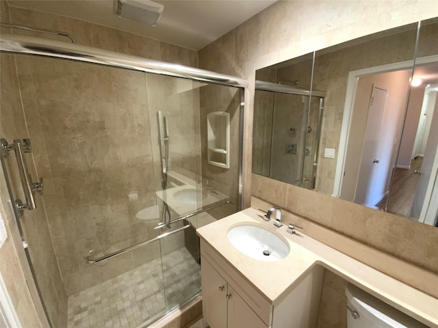 bathroom with vanity and an enclosed shower